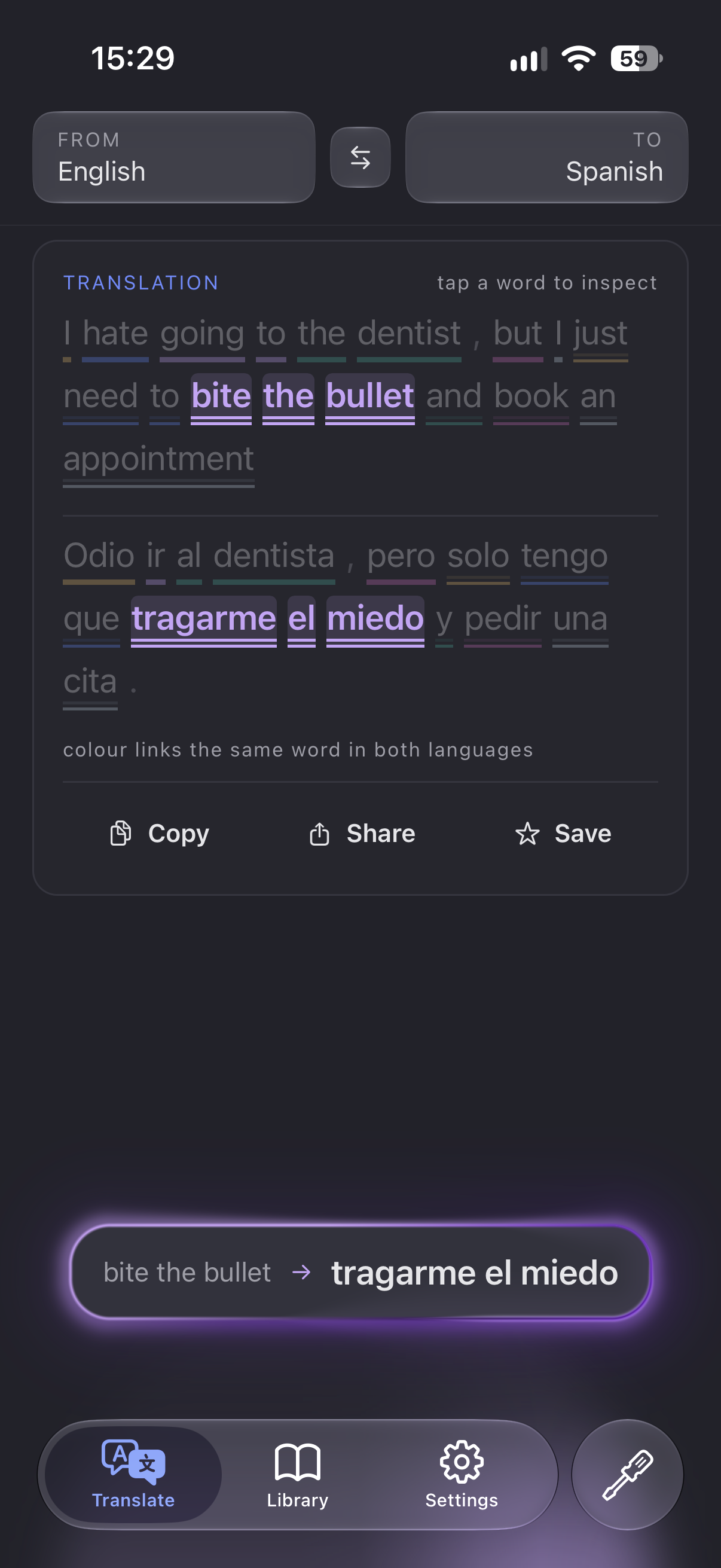 A held pair: “bite the bullet” and “tragarme el miedo” highlighted in lilac, with the pair lifted into a glowing bubble at the bottom of the screen.